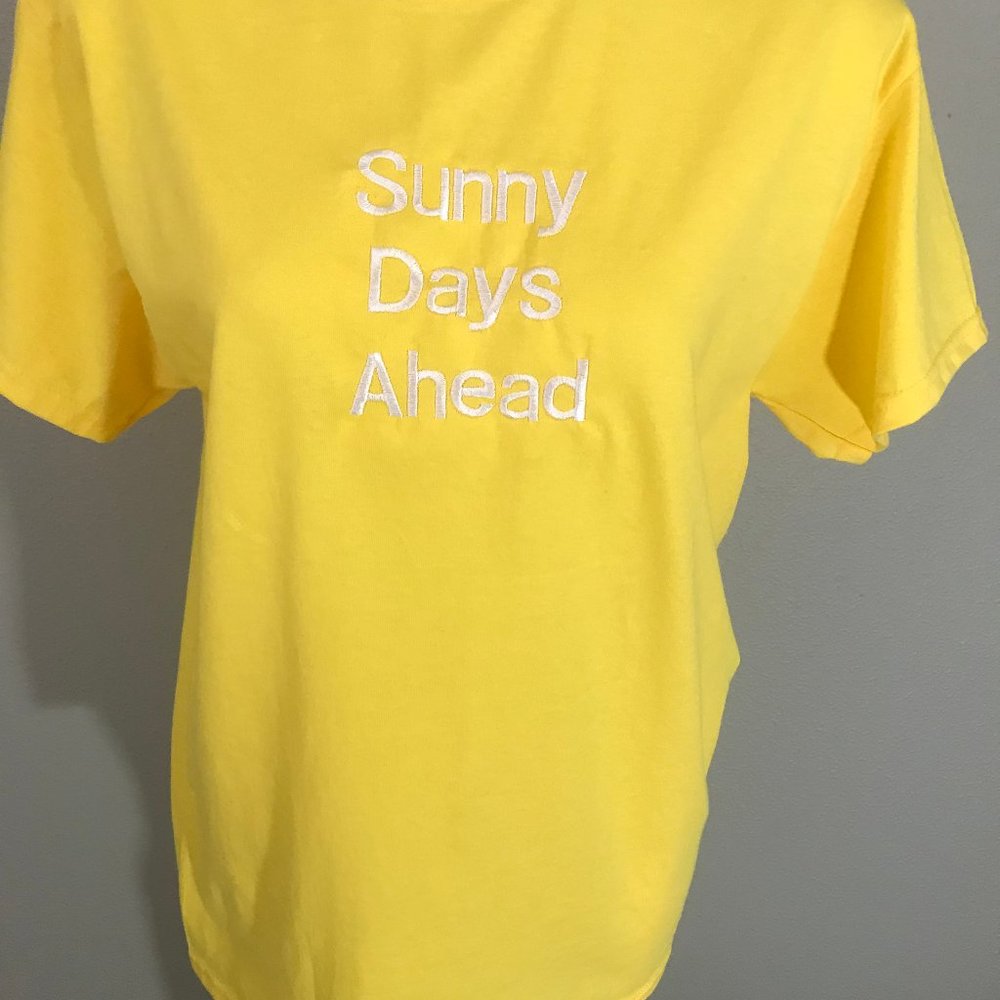 T shirt yellow and white lettering
